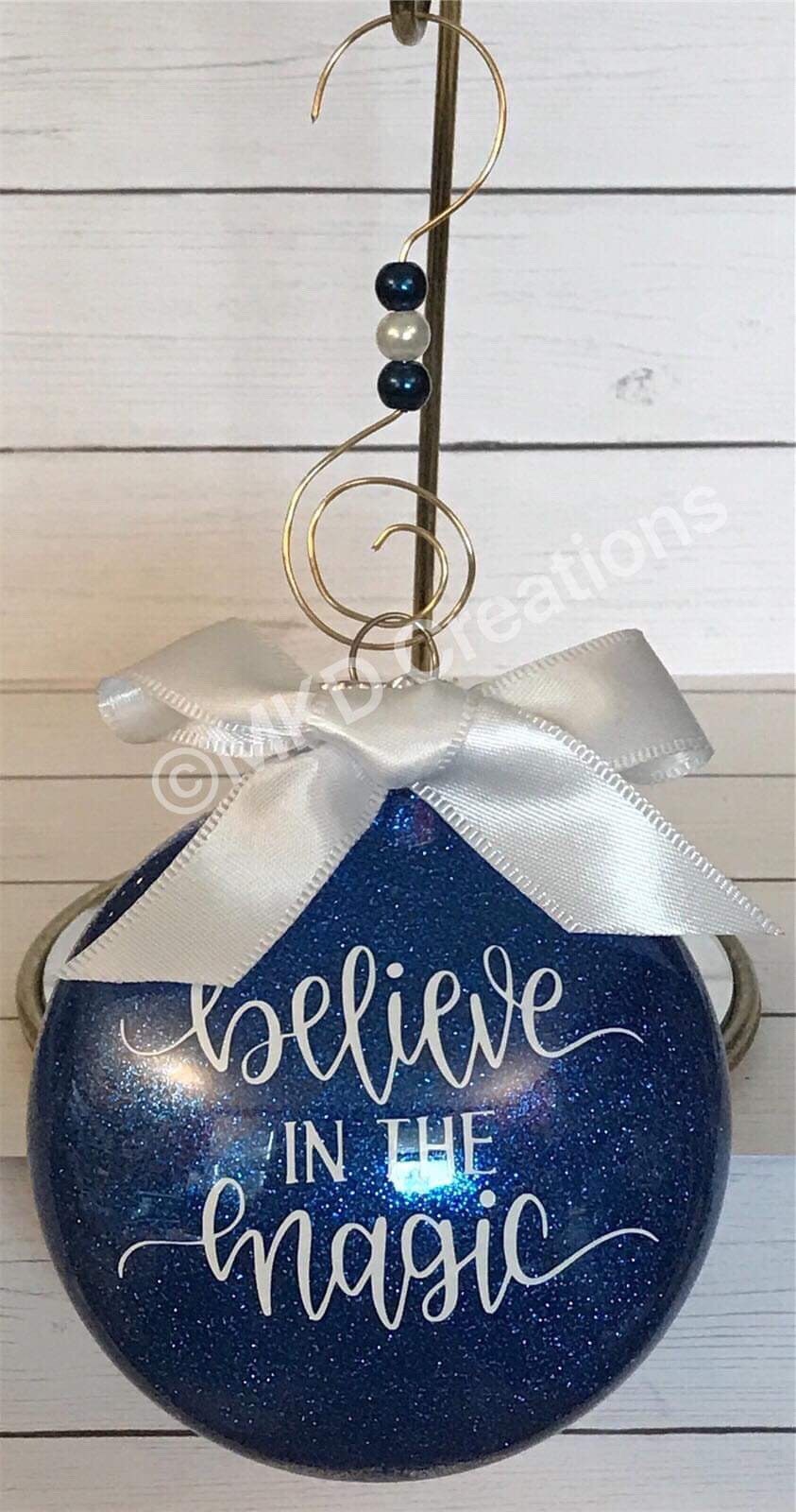 Believe in the Magic Glittered Ornaments | Plastic 3 inch disks filled with Blue glitter with hook & bow | Christmas Ornament