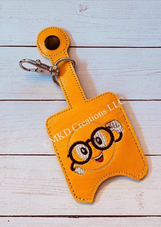 Smiley face wearing glasses Key chain hand sanitizer holder w/o 1 oz. hand sanitizer | key chain hand sanitizer not included